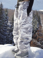 Gray camo oversized ski pants with drawcord waist, side view