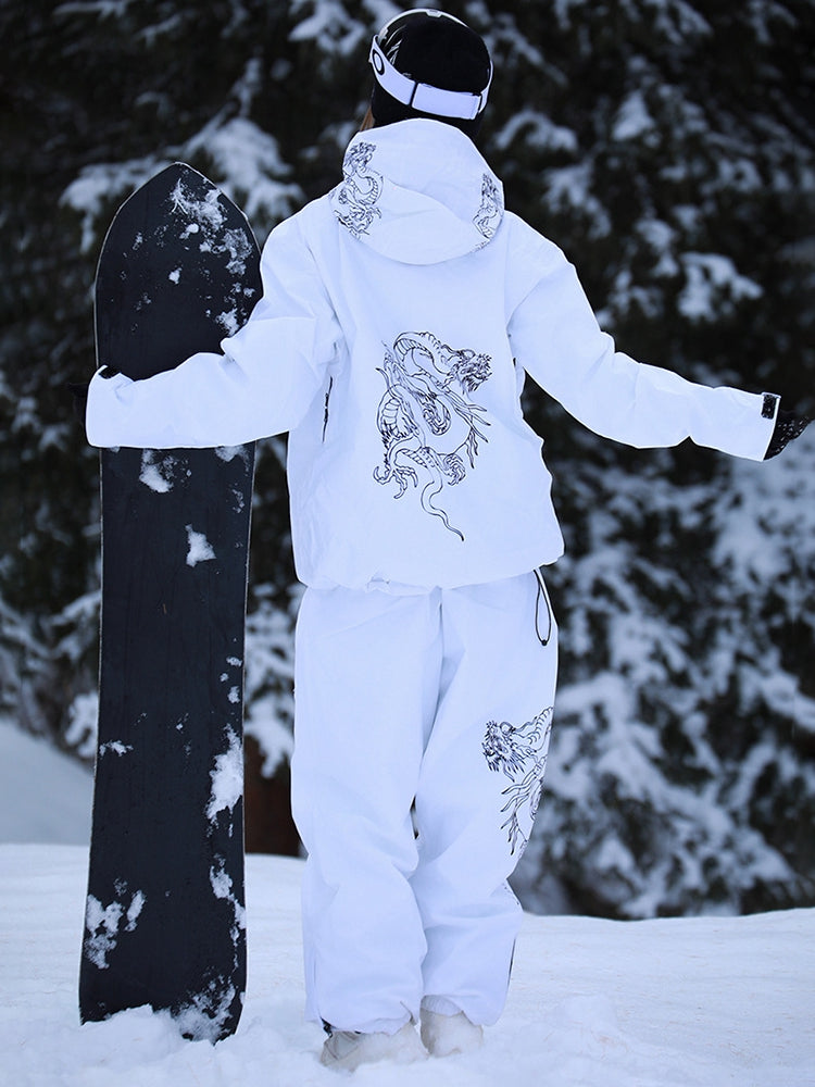 White baggy ski set worn with a snowboard on the slopes