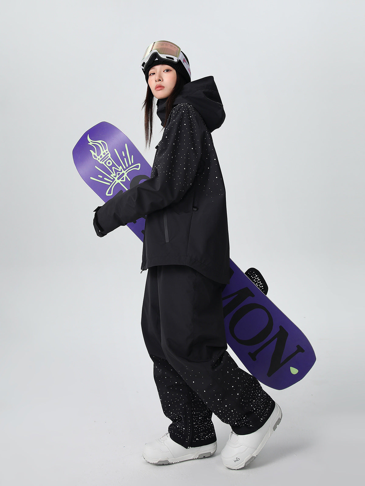 Side profile of the glitter ski suit showing the baggy relaxed fit