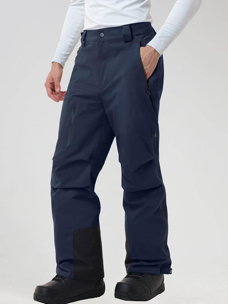 Men's insulated ski pants in Navy - front view with a hand in the zip pocket