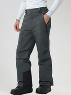 Men's insulated ski pants in Dark Grey - front view with a hand in the zip pocket