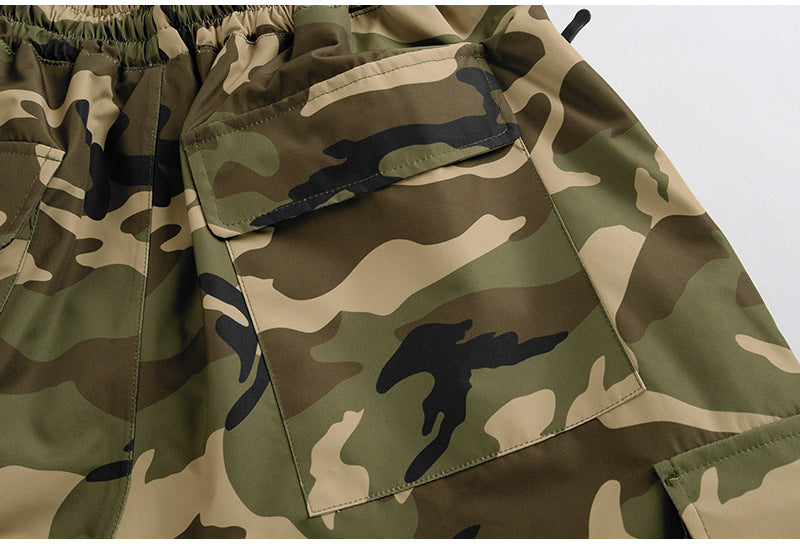 Cargo pockets and elastic waist on army green camo snow pants