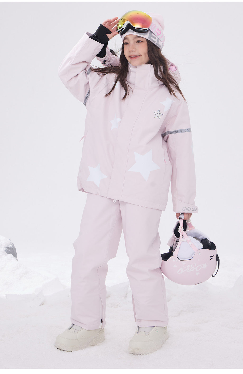 Girl in pink star print snow jacket with matching snow pants
