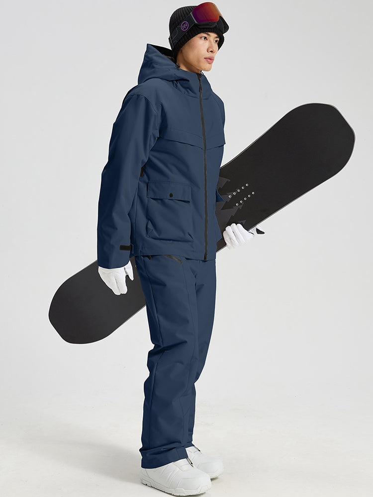 Men's navy snowboard jacket and pants set holding a snowboard