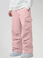Men's Baggy Cargo Pocket Ski Pants in Pink - Three-Quarter View with Hand in Pocket