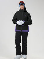 Men's black ski jacket and snow pants set, arms crossed