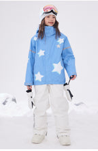 Girl in light blue star print ski jacket in the snow