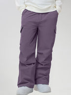 Men's Baggy Cargo Pocket Ski Pants in Purple - Front View with Hands in Pockets