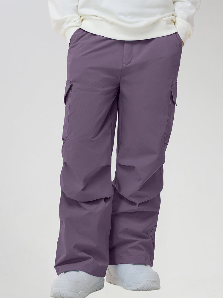 Men's Baggy Cargo Pocket Ski Pants in Purple - Front View with Hands in Pockets
