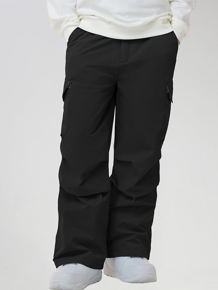 Men's Baggy Cargo Pocket Ski Pants in Black - Front View with Hands in Pockets