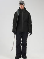 Men's all-black ski jacket and snow pants, holding a ski pole