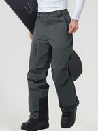 Men's insulated ski pants in Dark Grey worn with a snowboard