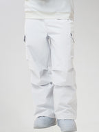 Men's Baggy Cargo Pocket Ski Pants in White - Front View with Hands in Pockets