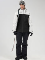 Men's white color-block ski jacket and black snow pants, holding ski poles