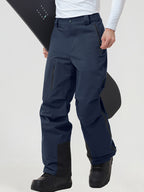 Men's insulated ski pants in Navy worn with a snowboard
