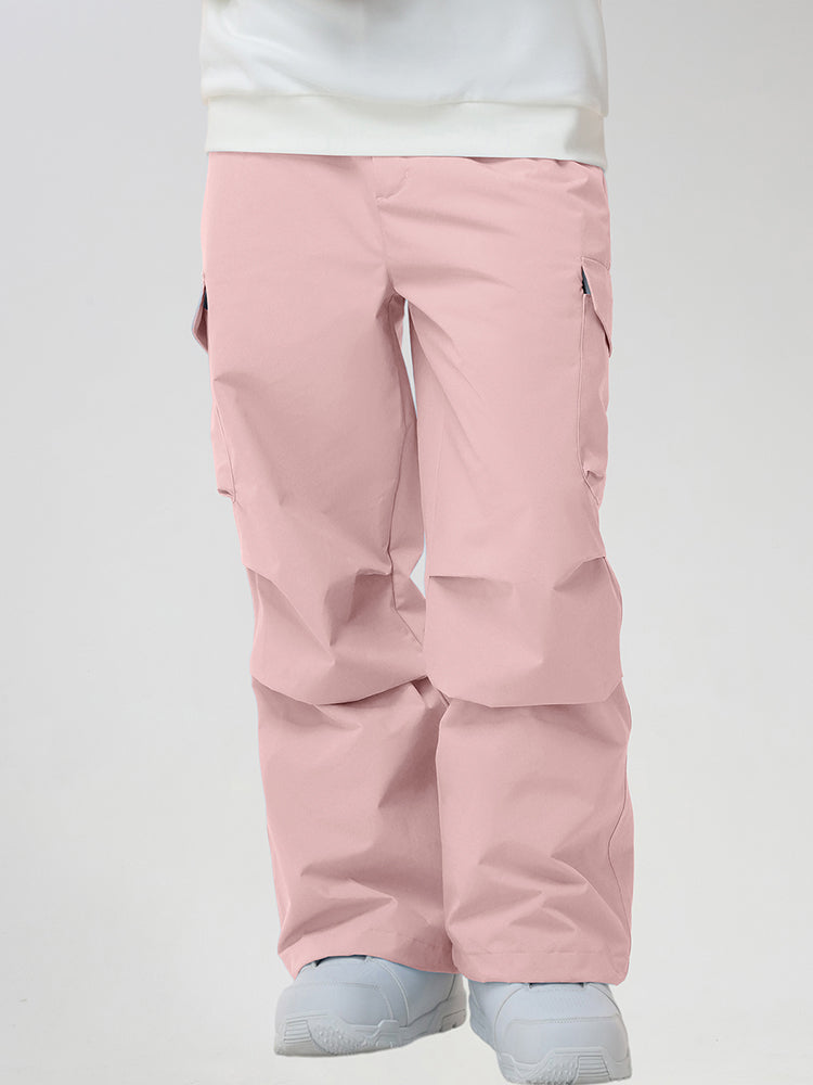 Men's Baggy Cargo Pocket Ski Pants in Pink - Front View with Hands in Pockets
