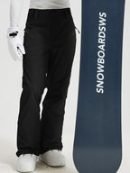 Men's Utility Snow Pants in Black – Standing View with Snowboard
