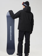 Men's all-black ski jacket and snow pants set, back view with a snowboard
