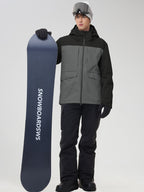 Men's grey color-block ski suit holding a snowboard, front view