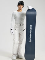 Men's Utility Snow Pants in White – Standing View with Snowboard