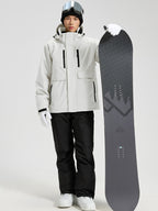 YEEFINE men's White cargo ski jacket and ski pants, posing with a snowboard, front view