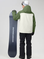 Men's army green ski suit back view, holding a snowboard