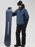 Men's blue color-block ski jacket and snow pants, holding a snowboard
