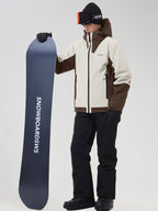 Men's beige color-block ski jacket and snow pants, holding a snowboard