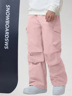 Men's Baggy Cargo Pocket Ski Pants in Pink - Model with Snowboard