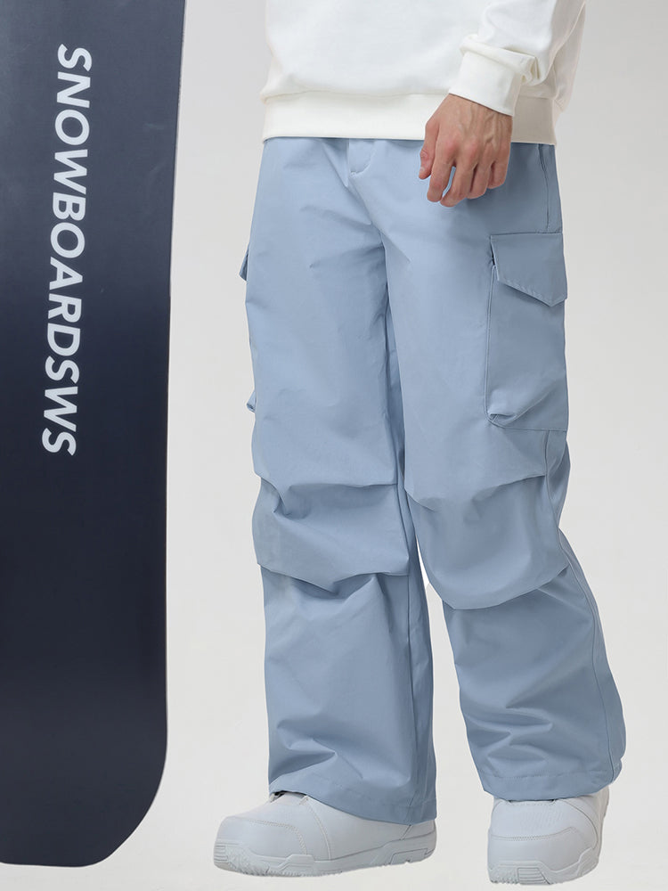 Men's Baggy Cargo Pocket Ski Pants in Light Blue - Model with Snowboard