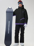 Front view of the men's casual ski jacket and snow pants set in black, holding a snowboard