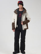 Men's beige color-block ski jacket with black snow pants, front view