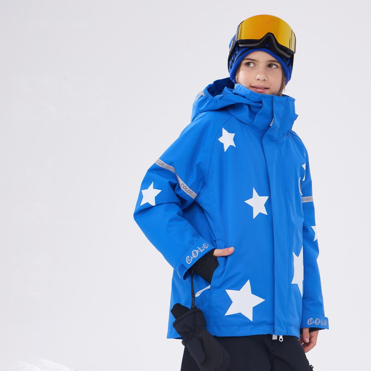 Kids' blue star print 3L waterproof ski jacket worn in the snow