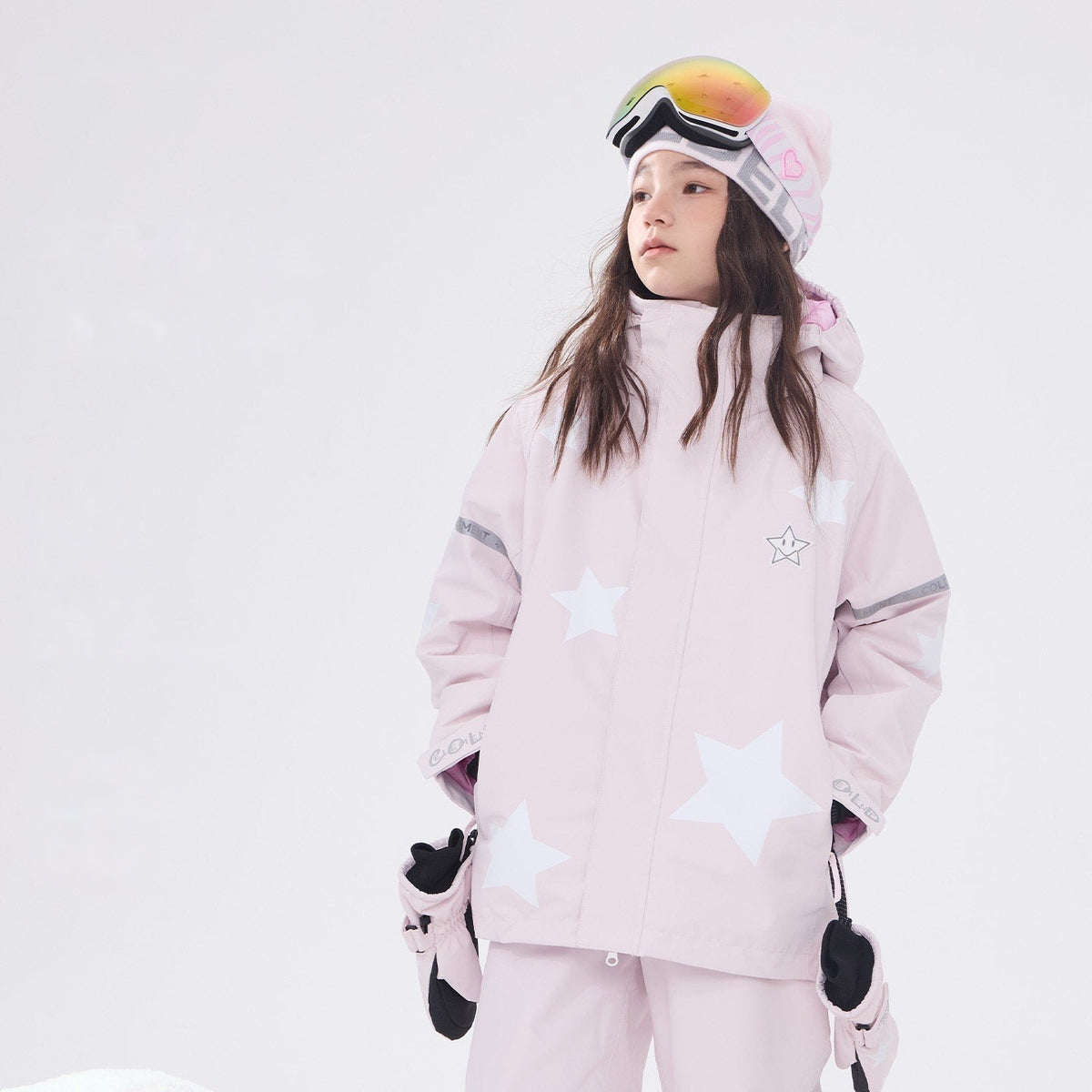Kids' pink star print 3L ski jacket worn by a girl model